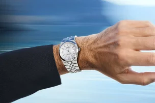 rolex-new-watches-2025-land-dweller-lifestyle-shot-roger-federer-wristshot