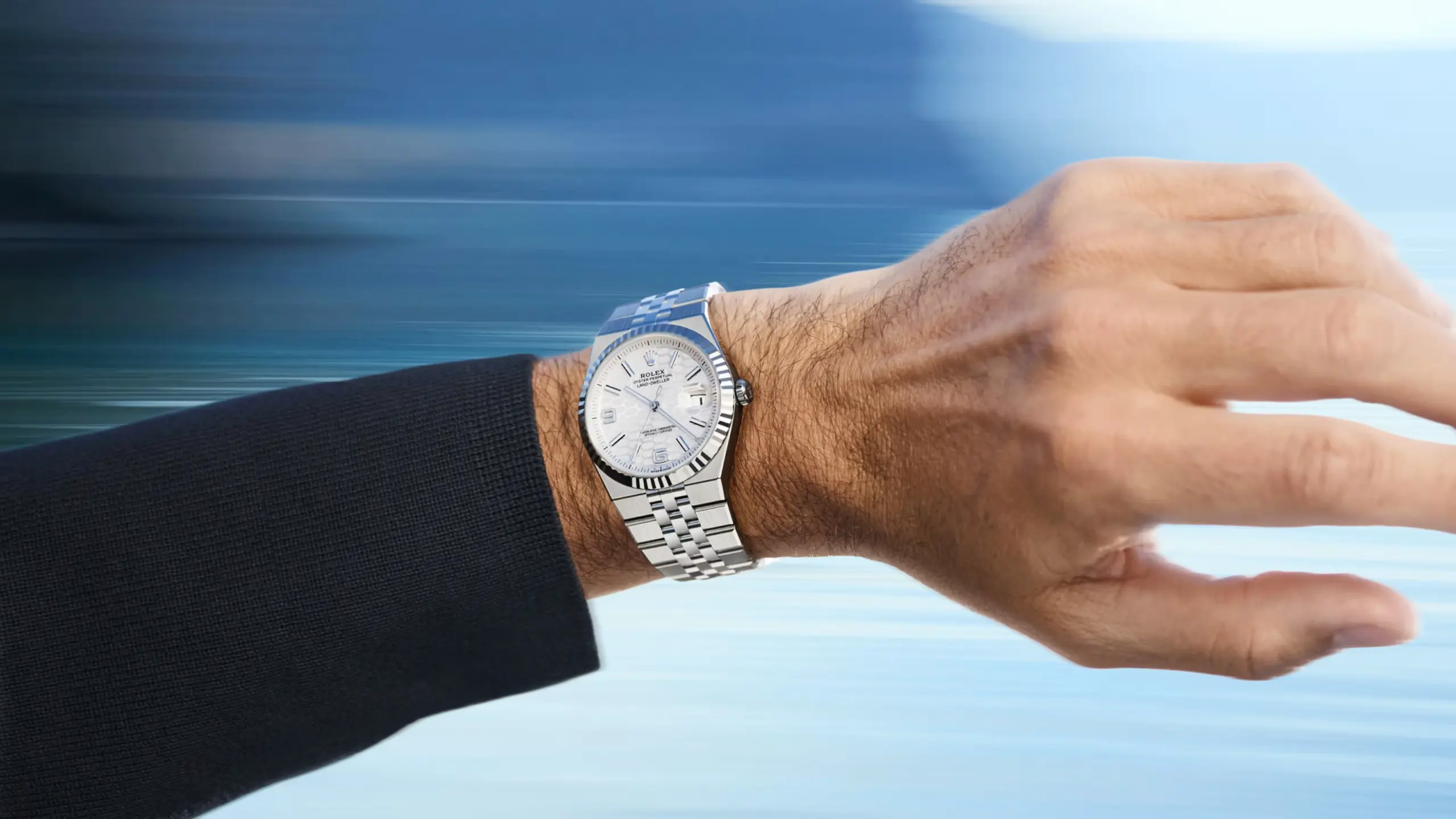 rolex-new-watches-2025-land-dweller-lifestyle-shot-roger-federer-wristshot