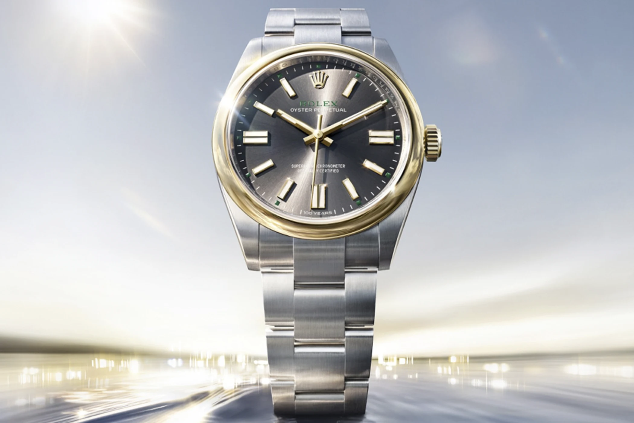 The Rolex Oyster Perpetual 41 in yellow Rolesor is shown from the front.